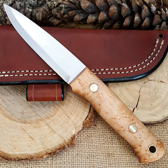 https://www.adventuresworn.com/cdn/shop/products/Birdseye-Maple-Classic-Bushcraft-Knife-02.jpg?v=1527638206&width=1445