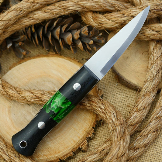 An Adventure Sworn bushcraft knife with black canvas micarta handle scales and green raffir stripes spacer.