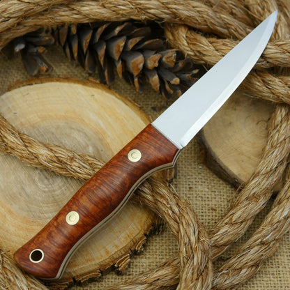 A Voyageur bushcraft knife with stabilized briar handle scales and ivory paper micarta liners