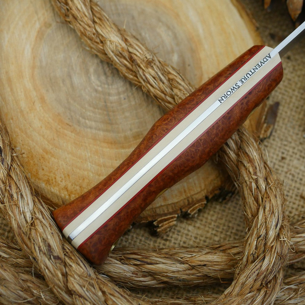 A Voyageur bushcraft knife with stabilized briar handle scales and ivory paper micarta liners