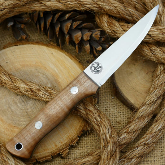 A Voyageur bushcraft knife with curly maple handle scales and double liners